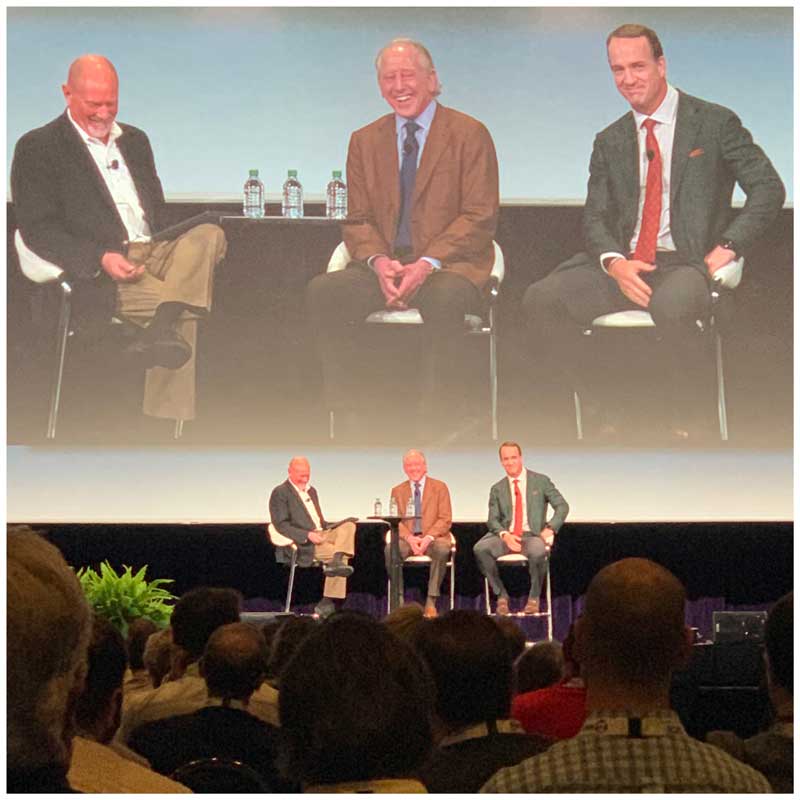 Archie Manning (center), former NFL quarterback, and his son Peyton Manning (right), two-time Super Bowl champion and five-time NFL MVP, speak during the MODEX conference.